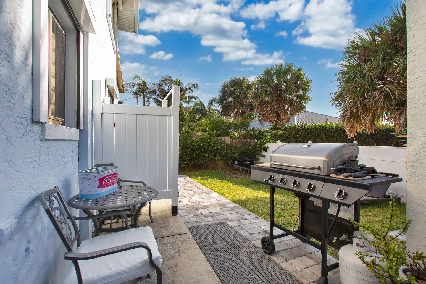 Modern Beach Retreat — Backyard grill area